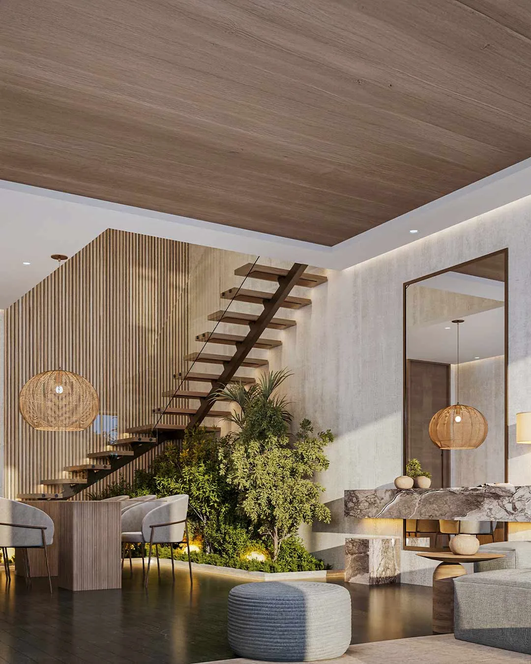 Double-height villa interior with a floating timber staircase and indoor garden