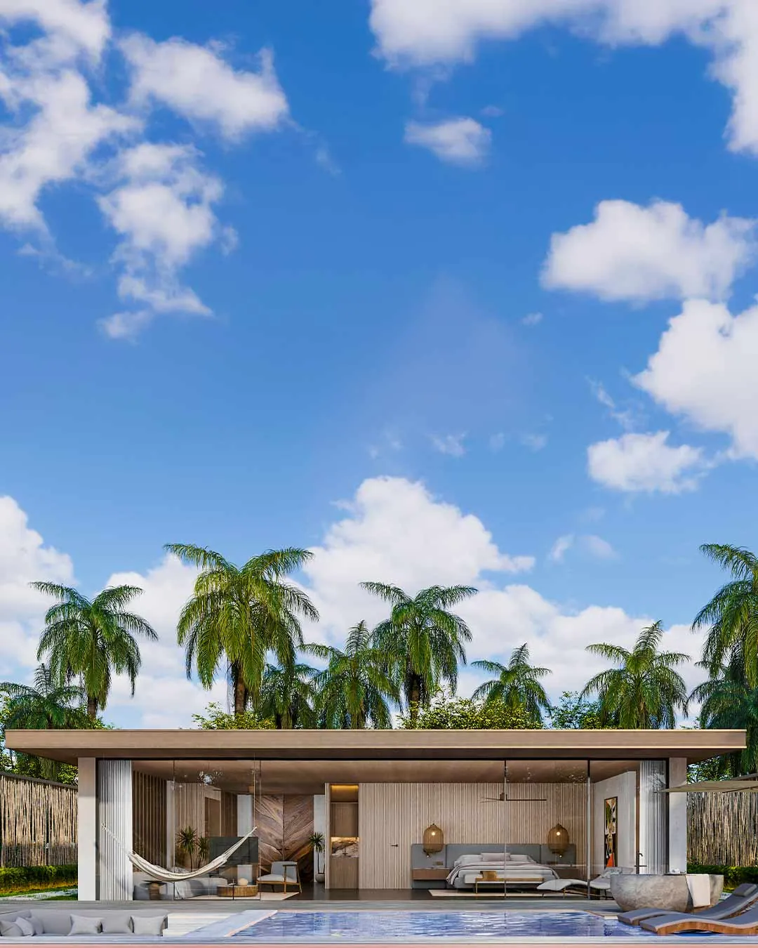 Single-storey villa with a pool terrace and hammock under tall palm trees and blue sky