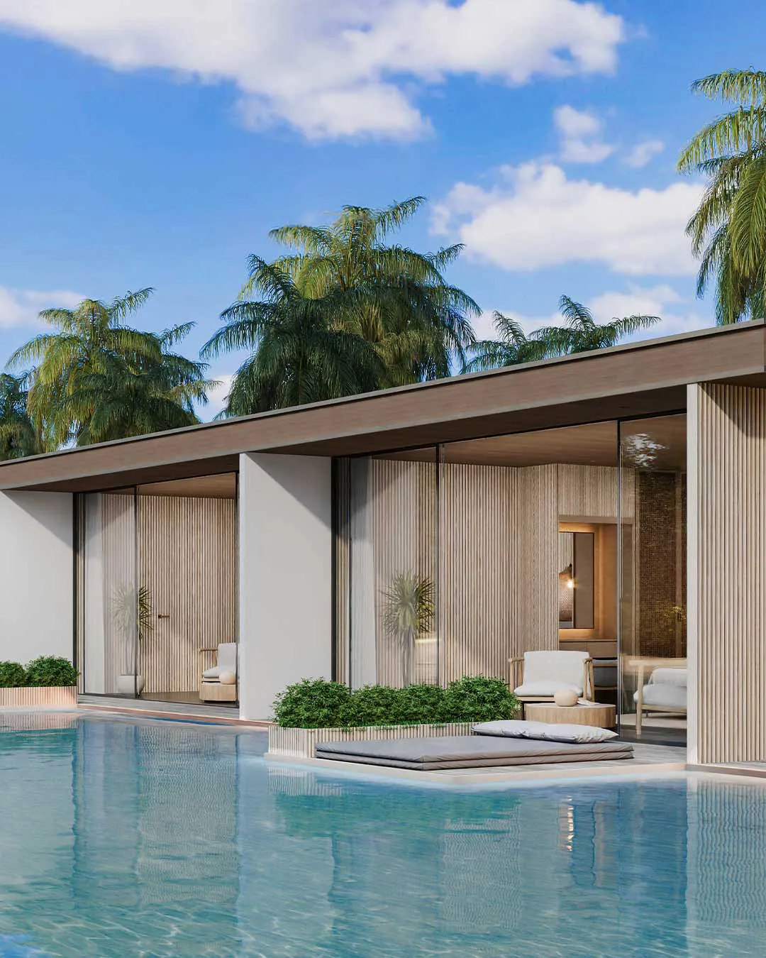 Private villa with an open living room facing its own pool, framed by palm trees